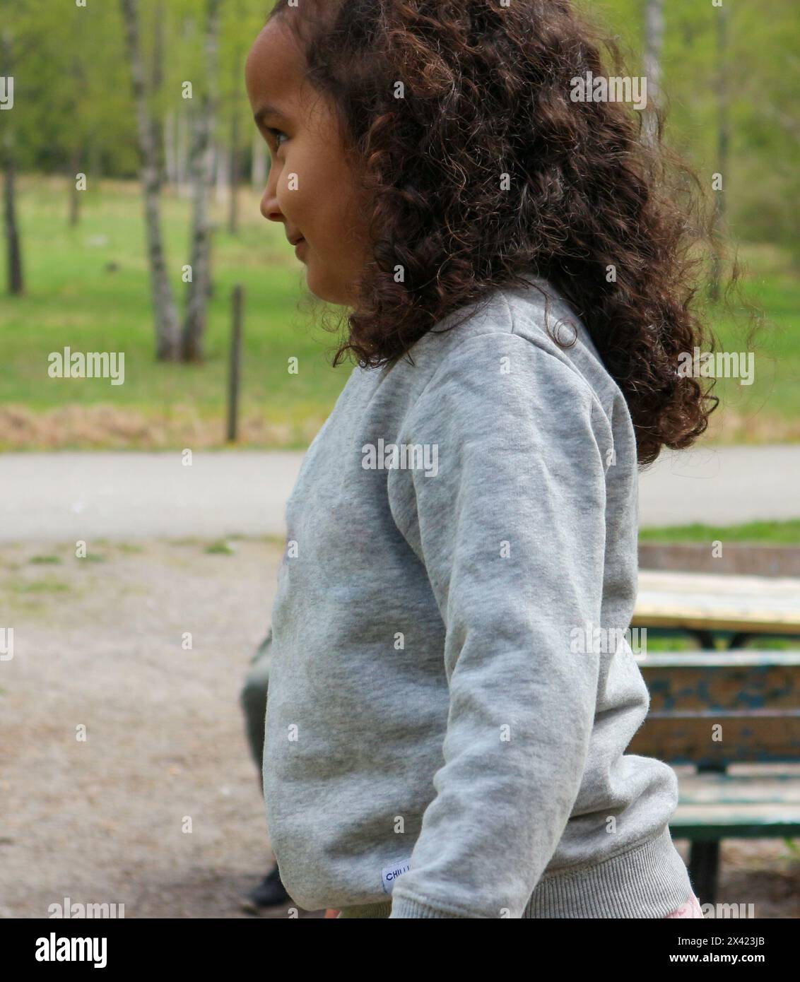 Girl curly hair standing hi-res stock photography and images - Alamy