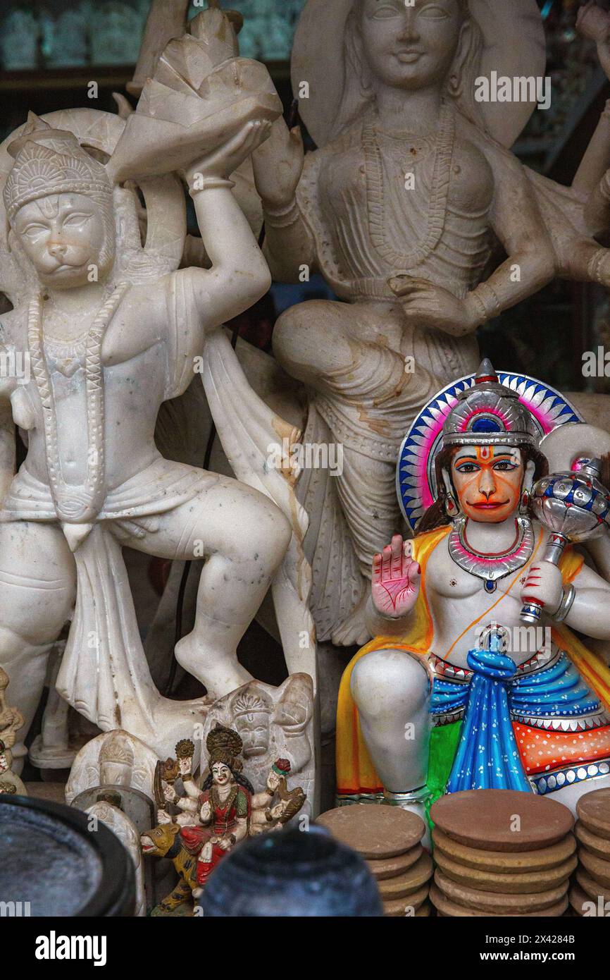 Shop in Varanasi, India with statues of gods and goddesses, one of which is painted. Stock Photo