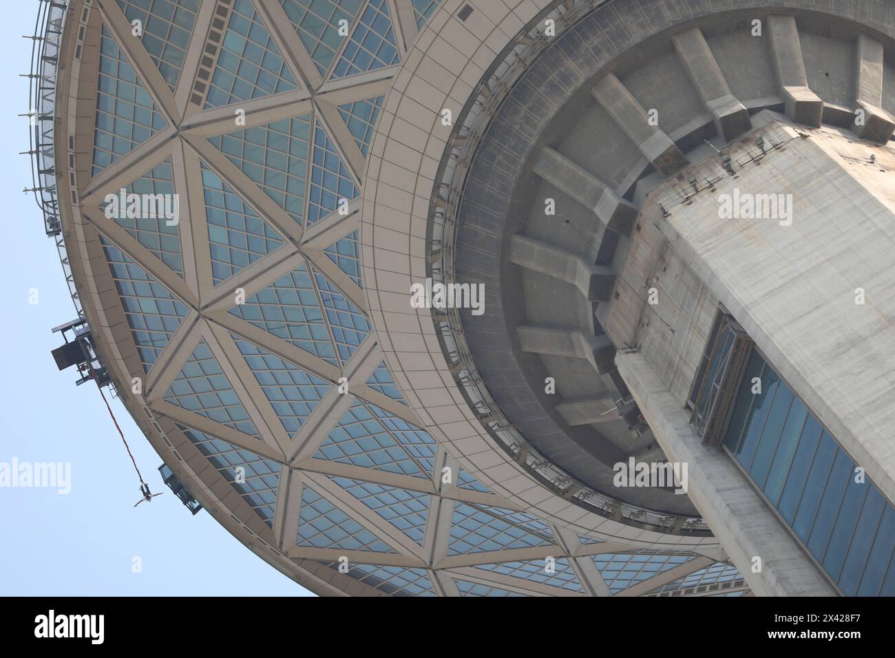 Tehran, Tehran, Iran. 29th Apr, 2024. An Iranian man jumps from the 280-meter-high bungee jumping platform at the Milad tower in Tehran, Iran, on 29 April 2024. According to Amir Badri, the head of the Gmax entertainment department manager, the platform was inaugurated at the Milad Tower on 29 April 2024. (Credit Image: © Sobhan Farajvan/Pacific Press via ZUMA Press Wire) EDITORIAL USAGE ONLY! Not for Commercial USAGE! Credit: ZUMA Press, Inc./Alamy Live News Stock Photo