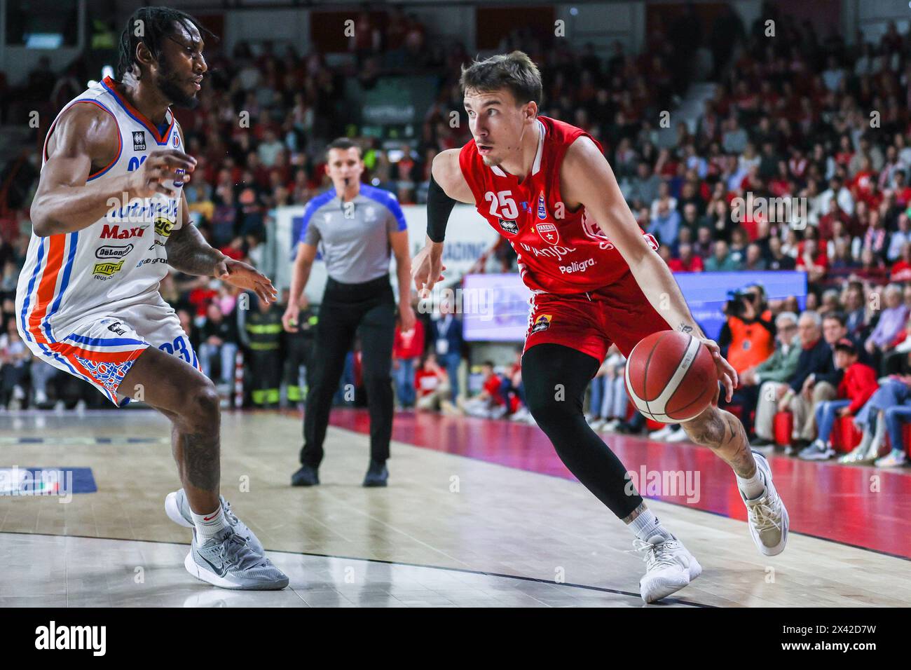 Varese, Italy. 28th Apr, 2024. Hugo Besson #25 of Pallacanestro Varese OpenJobMetis (R) and Pauly Paulicap #33 of Nutribullet Treviso Basket (L) seen in action during LBA Lega Basket A 2023/24 Regular Season game between Pallacanestro Varese OpenJobMetis and Nutribullet Treviso Basket at Itelyum Arena. FINAL SCORE OJM Varese 95 | 100 Treviso Basket Credit: SOPA Images Limited/Alamy Live News Stock Photo