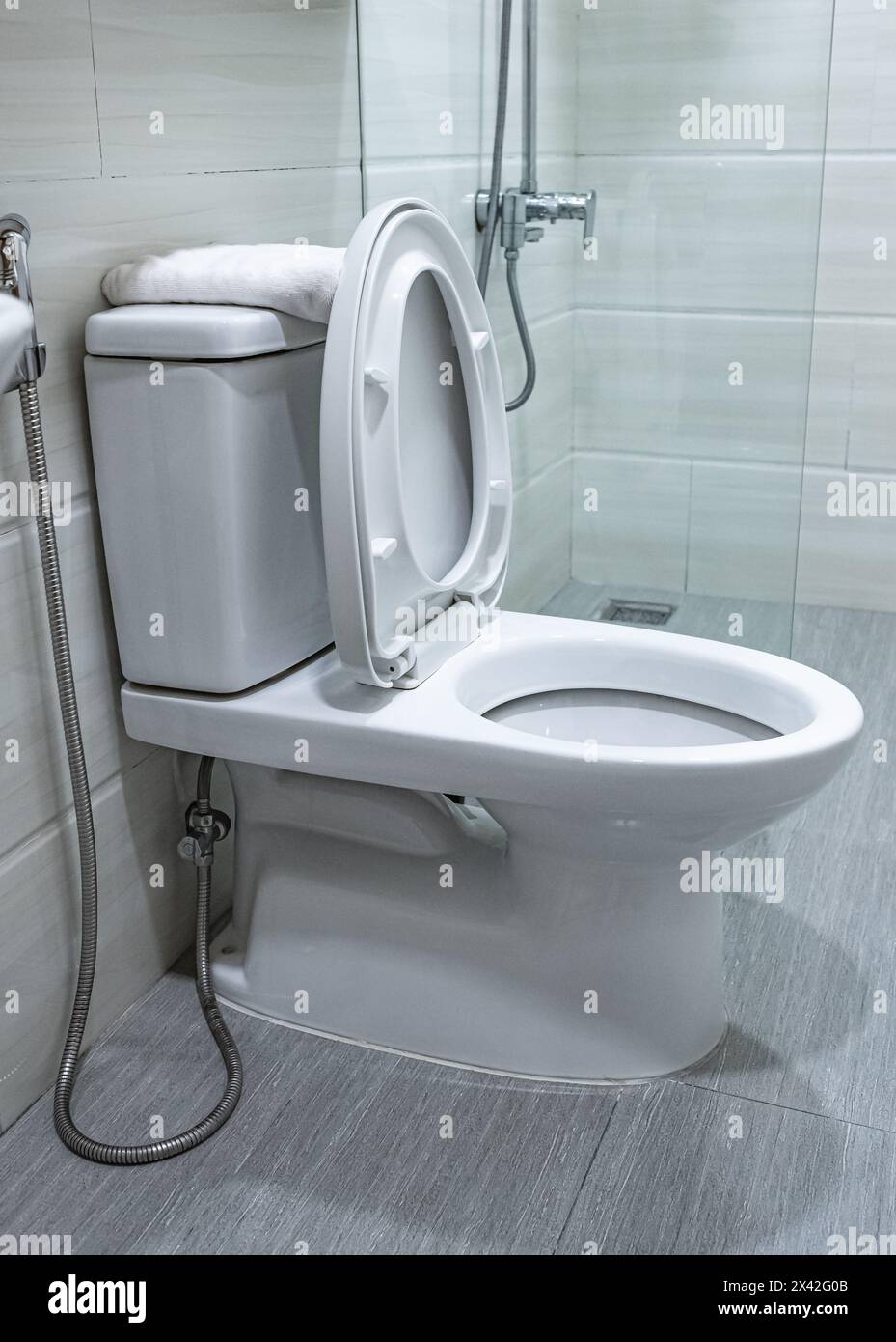 Toilet bowl in modern bathroom interior. White ceramic toilet bowl ...