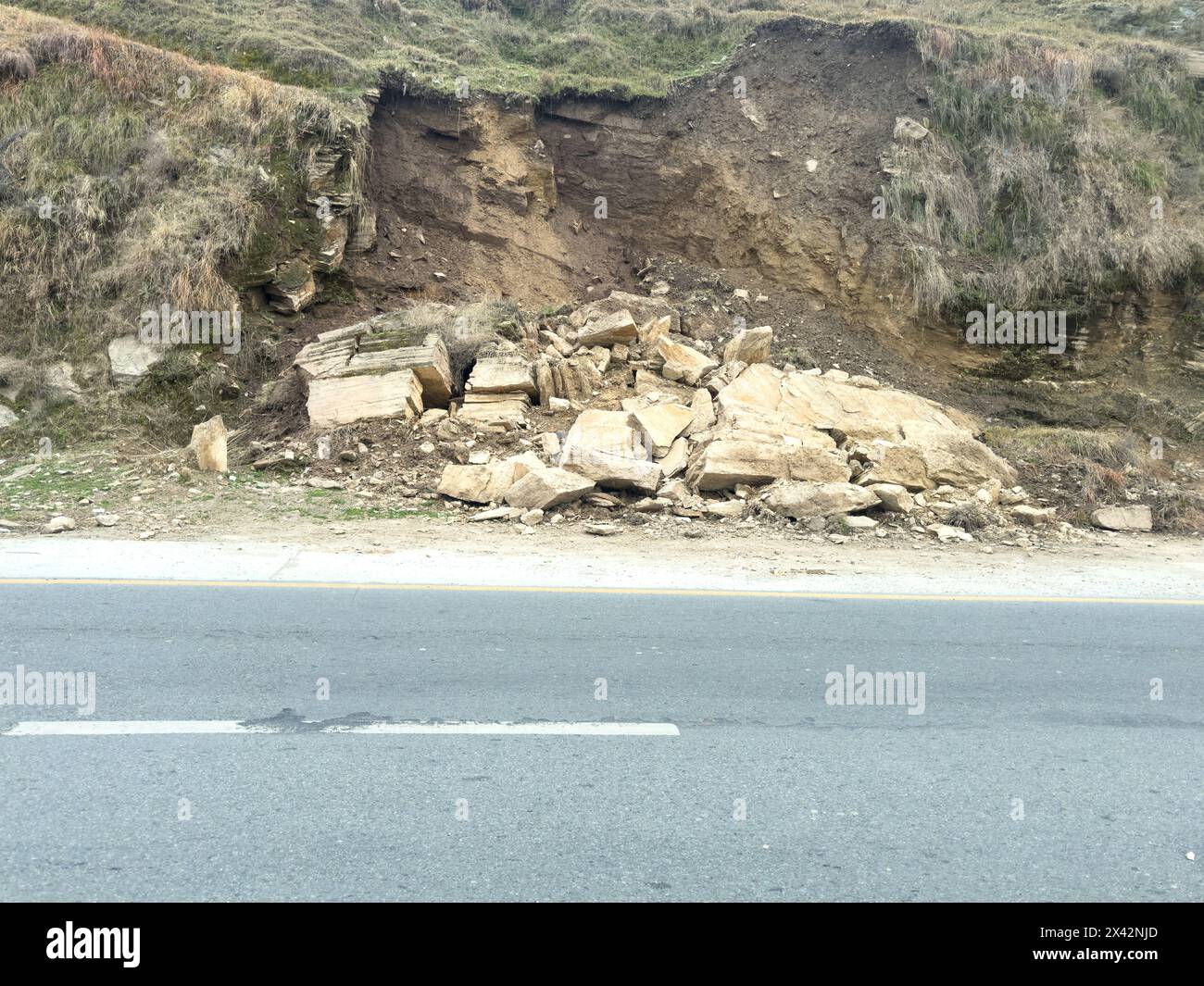 Landslide at rural road in swat valley due to heavy rain in Pakistan. Stock Photo