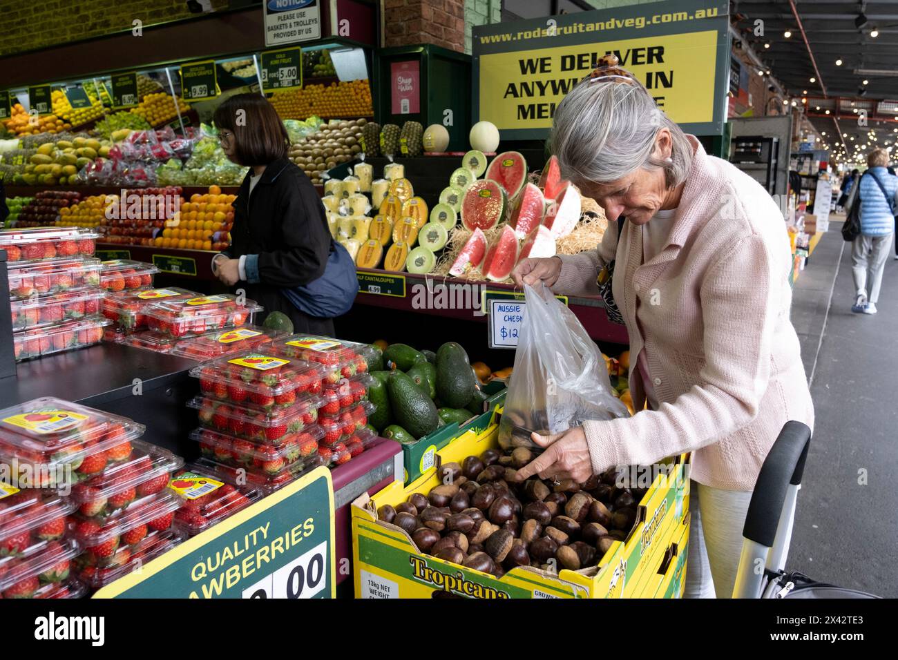 Shoppers at the South Melbourne market. The market is an inner city landmark and favorite of tourists. South Melbourne, Victoria, Australia. Stock Photo