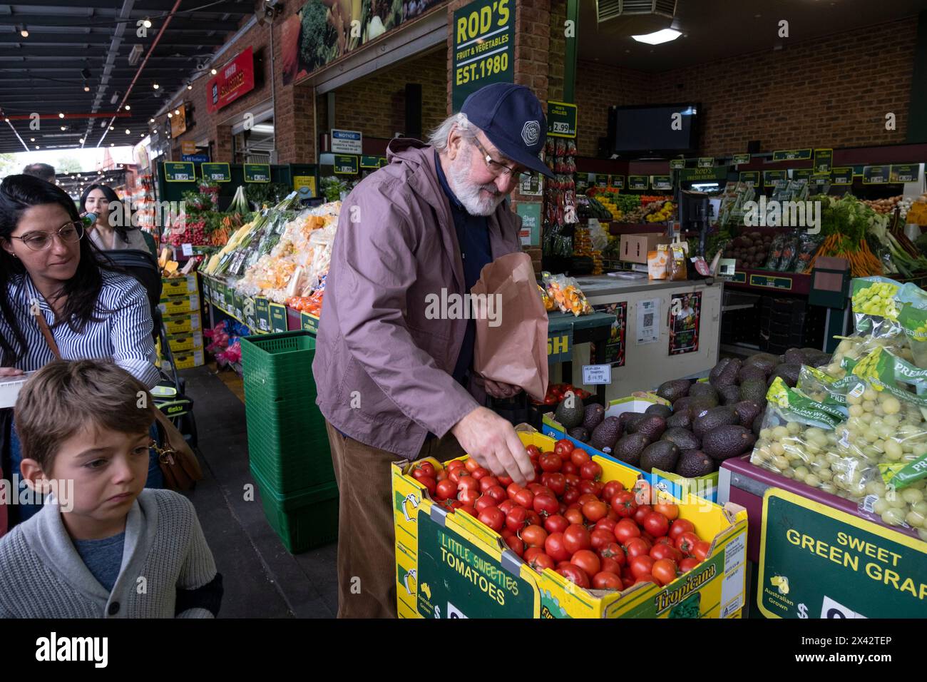 Shoppers at the South Melbourne market. The market is an inner city landmark and favorite of tourists. South Melbourne, Victoria, Australia. Stock Photo