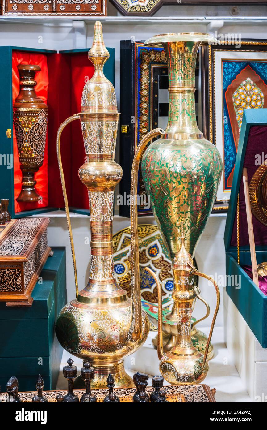 traditional oriental Uzbek copper teapots, decanters, jugs and vases in a souvenir shop in Uzbekistan in Tashkent Stock Photo