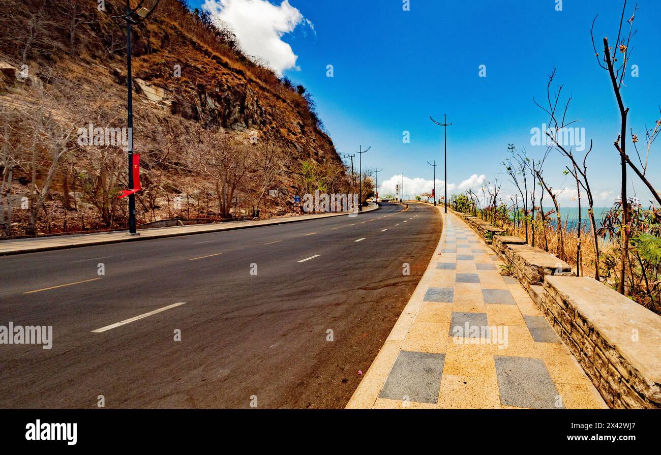 empty road small town developing country Vung Tau Vietnam leading line Stock Photo