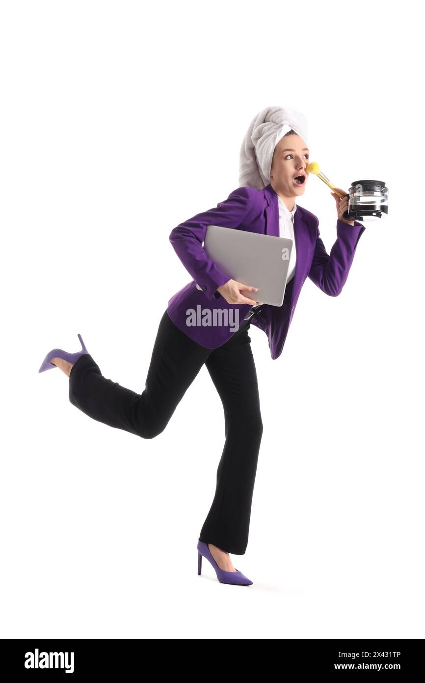 Morning of funny businesswoman with laptop and teapot trying to meet deadline on white background Stock Photo