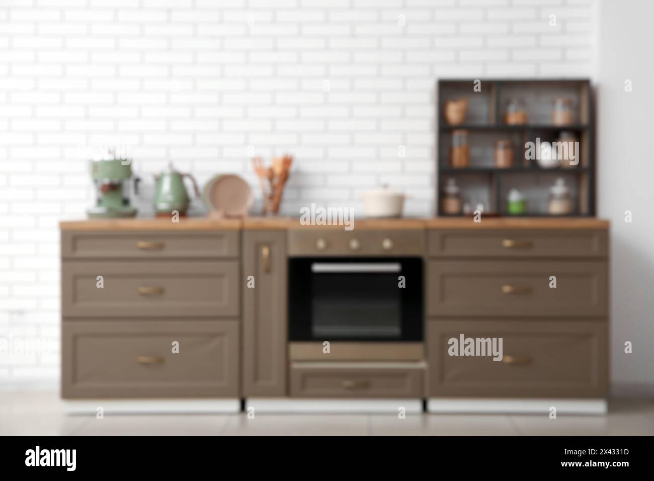 Stylish interior of kitchen with oven, brown counters and shelving unit ...