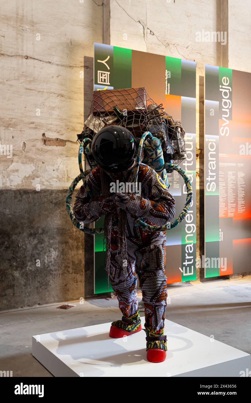 Venice, Italy - April 17, 2024: Installation by Yinka Shonibare titled Refugee Astronaut VIII exposed at the Arsenale during the 60th International Ar Stock Photo