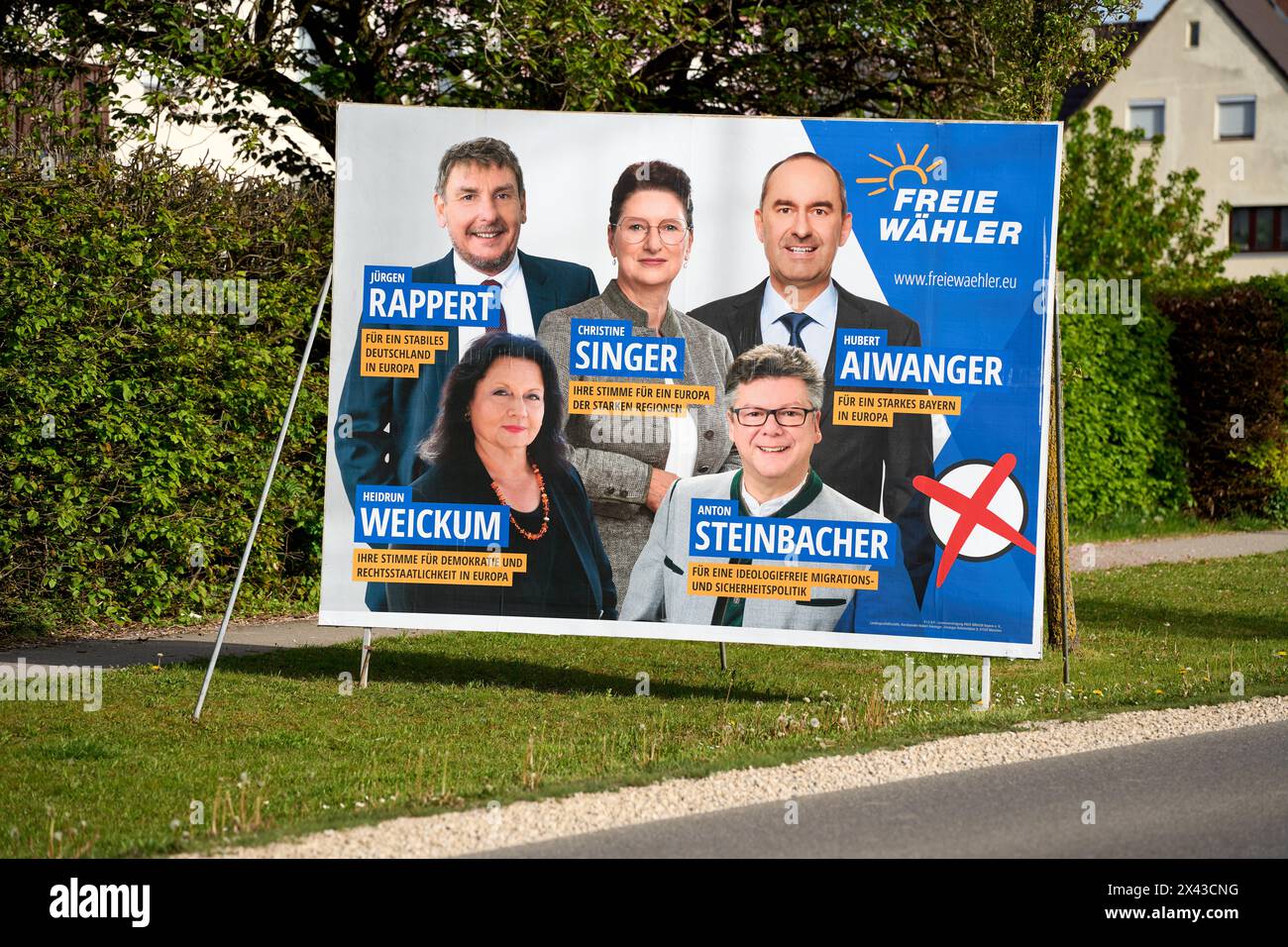 Stettenhofen, Bavaria, Germany - April 29, 2024: Election posters for the European elections 2024. The party Freie Wähler advertise with a large sign on the roadside *** Wahlplakate zur Europawahl 2024. Die Partei Freie Wähler werben mit einem Großen Schild am Straßenrand Stock Photo