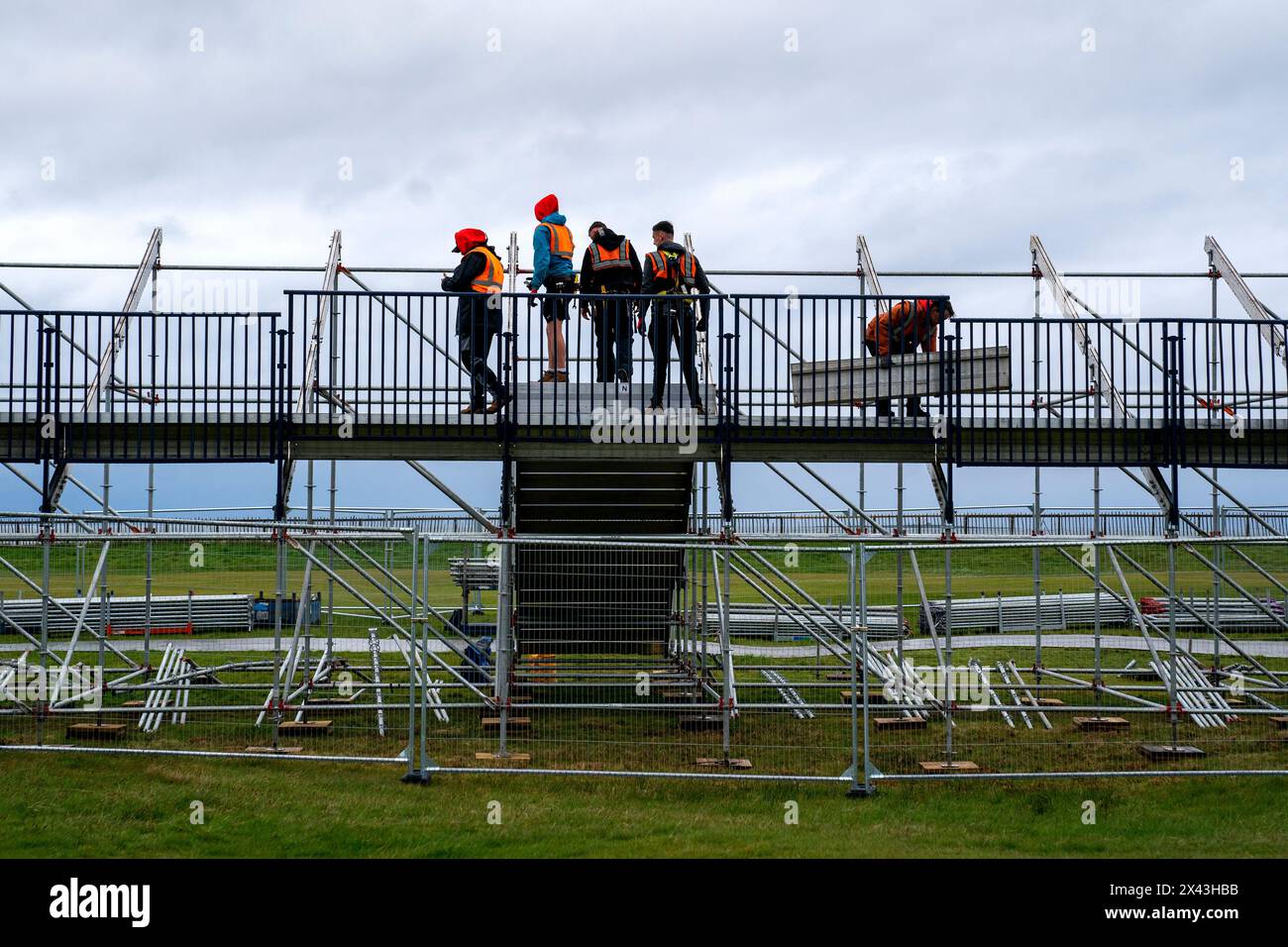 Construction workers build a grandstand alongside the 18th green during the 152nd Open Media Day at Royal Troon Golf Club, South Ayrshire. Picture date: Tuesday April 30, 2024. Stock Photo