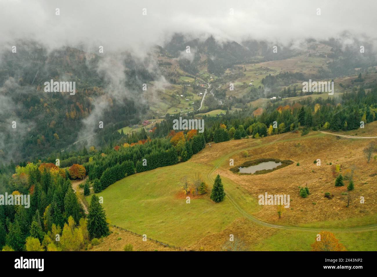 Aerial view of mountains covered with fog Stock Photo - Alamy