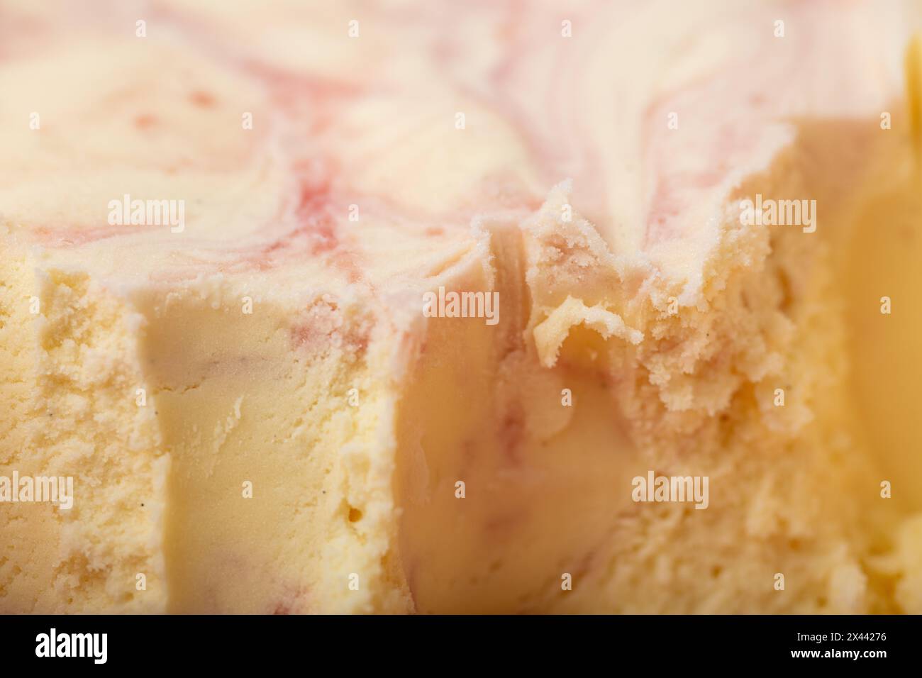 Border or edge after portioning homemade vanilla ice cream with cranberry variegato Stock Photo