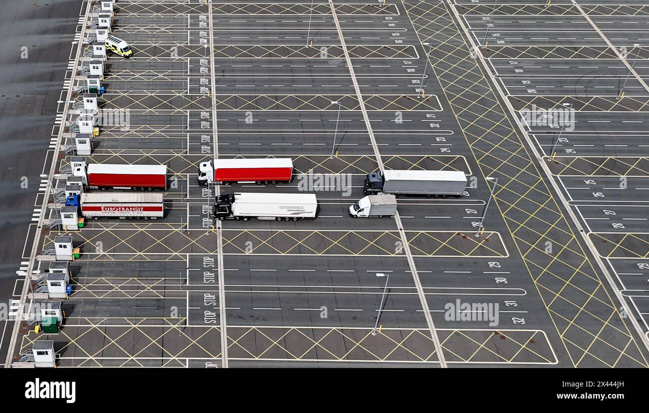 Lorries at the Sevington Inland Border Facility in Ashford, Kent, as physical, documentary and identity post-Brexit border control checks begin on medium and high-risk plant and animal imports from the EU, as part of the Border Target Operating Model (BTOM) plan. Picture date: Tuesday April 30, 2024. The introduction of post-Brexit border checks has been delayed several times over fears they could fuel inflation, but began to be introduced from the start of this year. Stock Photo