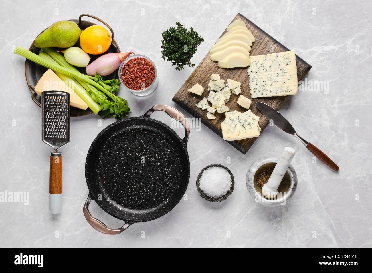Top view of ingredients for risotto with pink rice, pear and blue cheese Stock Photo