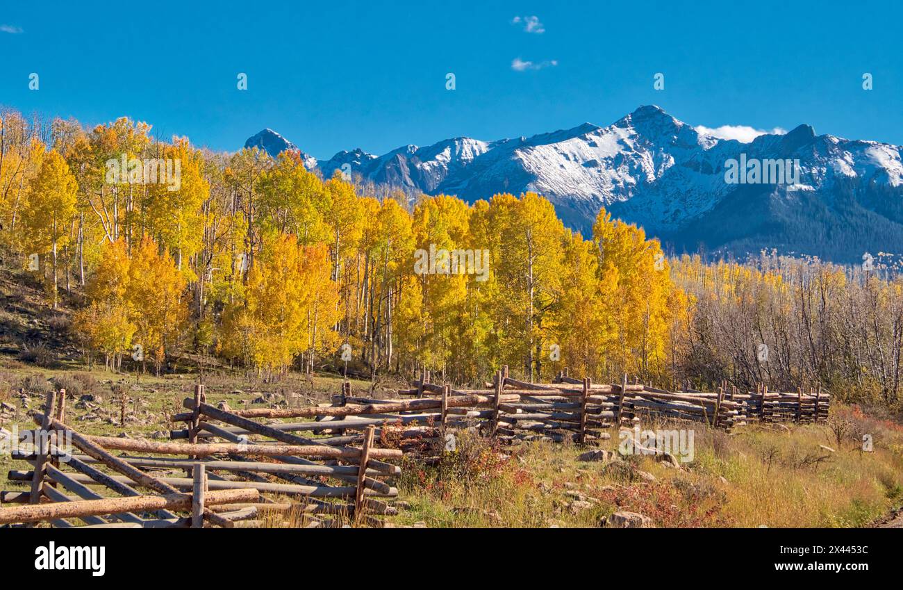 USA, Colorado, Quray. Dallas Divide, sunrise on the Mt. Snaffles with autumn colors and split rail fence Stock Photo
