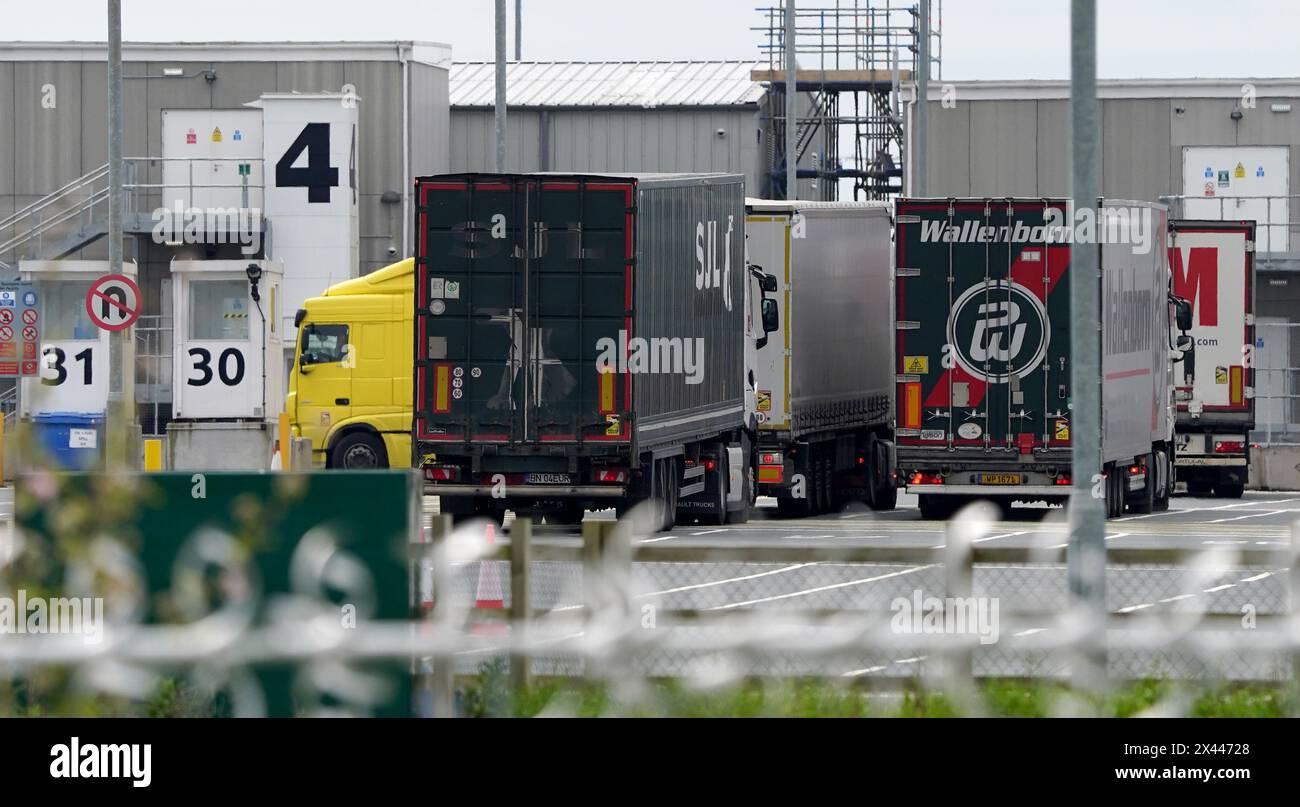 Lorries at the Sevington Inland Border Facility in Ashford, Kent, as physical, documentary and identity post-Brexit border control checks begin on medium and high-risk plant and animal imports from the EU, as part of the Border Target Operating Model (BTOM) plan. Picture date: Tuesday April 30, 2024. The introduction of post-Brexit border checks has been delayed several times over fears they could fuel inflation, but began to be introduced from the start of this year. Stock Photo