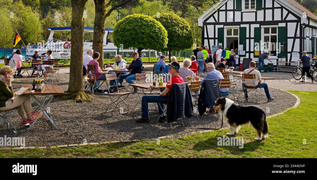People at the Royal Lockkeeper's House on the Ruhr with the motor vessel MS Schwalbe II, Witten, North Rhine-Westphalia, Germany Stock Photo