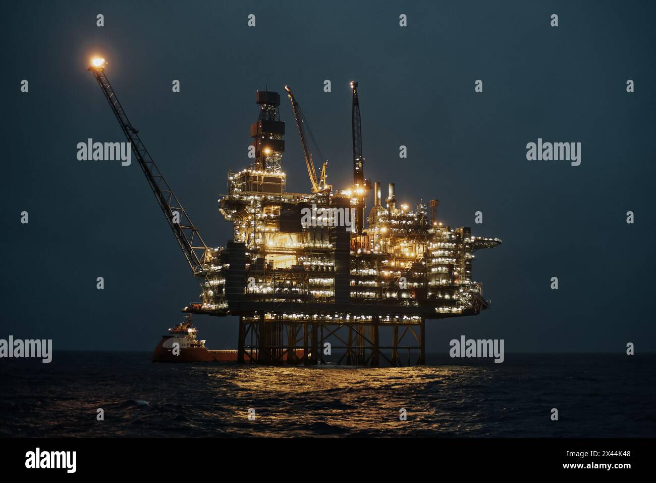 Offshore oil and gas jackup platform, during cargo operations with ...