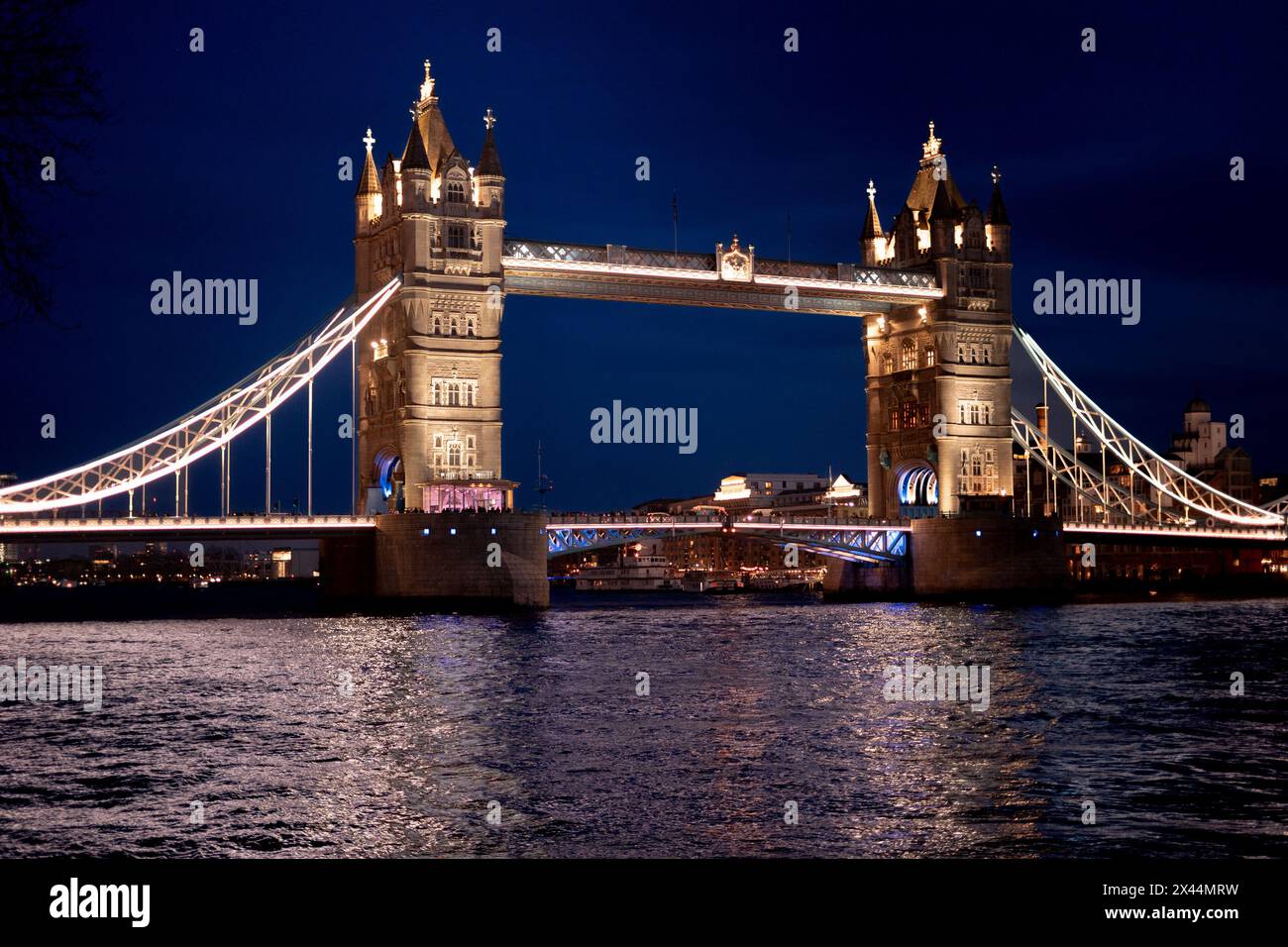 The Tower Bridge inn London over the River Thames at Night Stock Photo