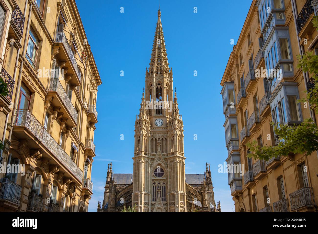 Majestic New Gothic Cathedral Towering Over the City Streets on a Sunny Day, San Sebastián Donostia, Spain Stock Photo