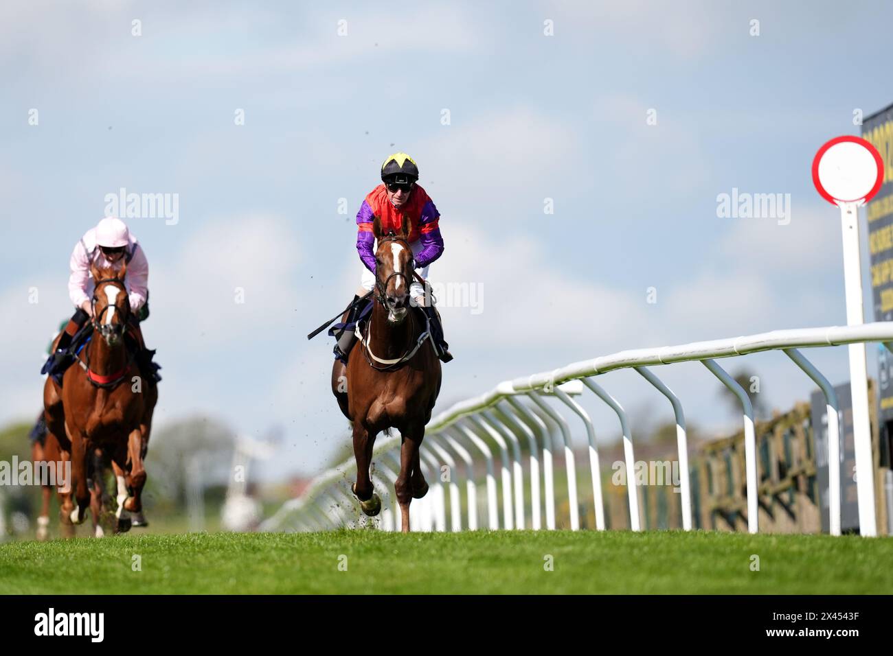 The African Queen ridden by Joe Fanning (centre) on their way to winning the British Stallion Studs EBF Fillies' Handicap at Brighton Racecourse. Picture date: Tuesday April 30, 2024. Stock Photo