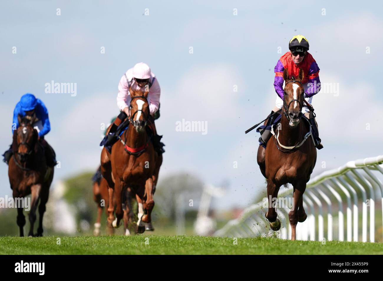 The African Queen ridden by Joe Fanning (centre) on their way to winning the British Stallion Studs EBF Fillies' Handicap at Brighton Racecourse. Picture date: Tuesday April 30, 2024. Stock Photo