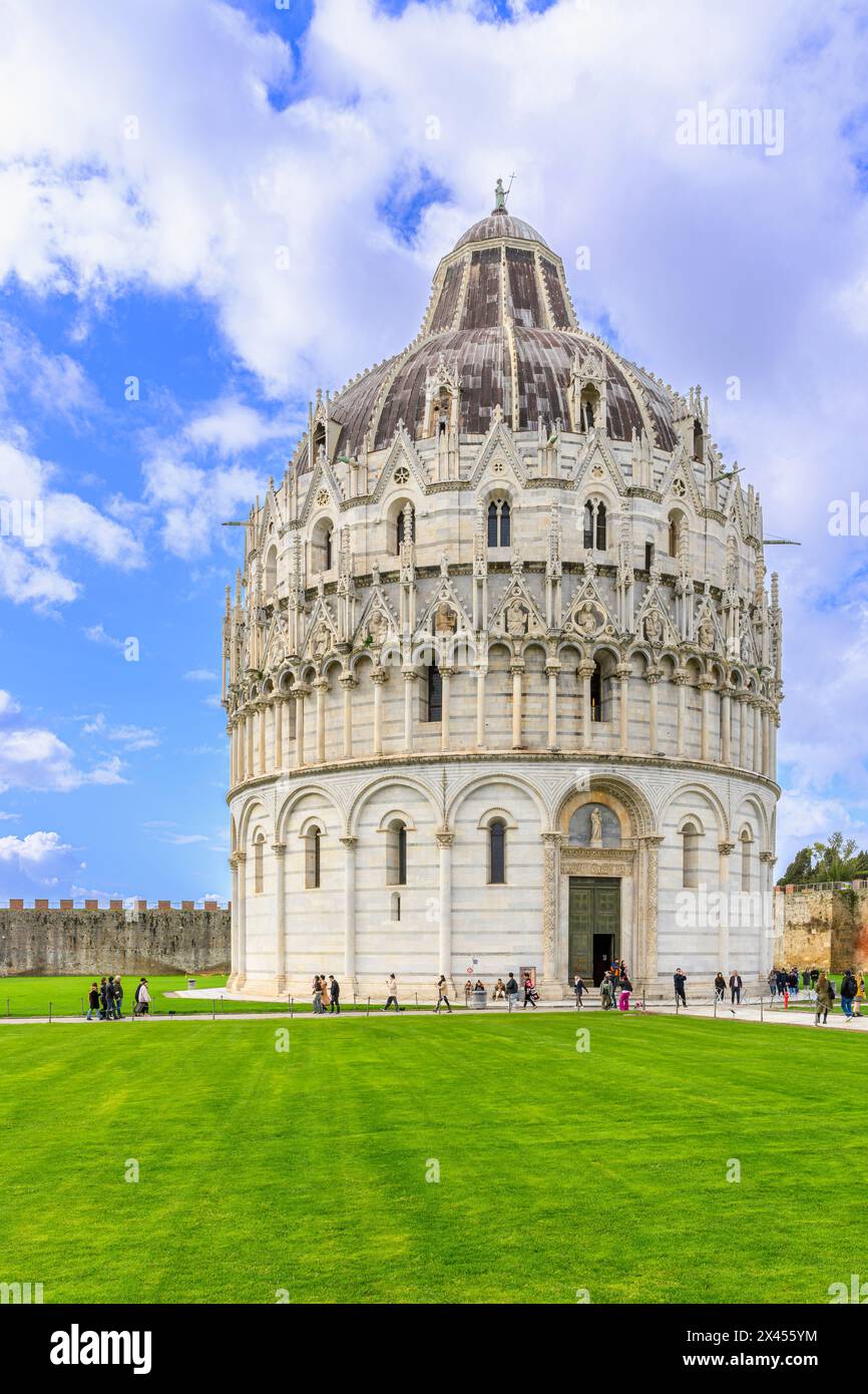 The wonderfully ornate Baptist church (Battistero di San Giovanni) close to the Campanile bell tower - the leaning tower of Pisa. Stock Photo