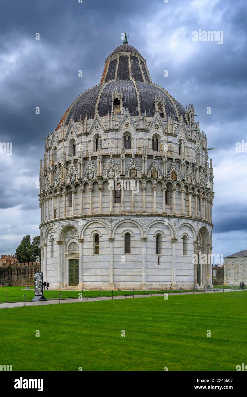 The wonderfully ornate Baptist church (Battistero di San Giovanni) close to the Campanile bell tower - the leaning tower of Pisa. Stock Photo