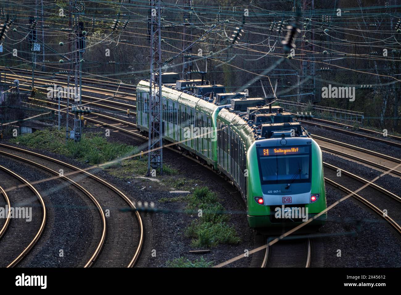 S-Bahn train on the tracks, railroad system, railway line west of the main station of Essen, NRW, Germany, Stock Photo
