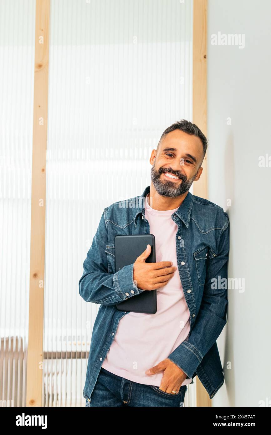 Portrait of a smiling middle-aged white man in a coworking Stock Photo