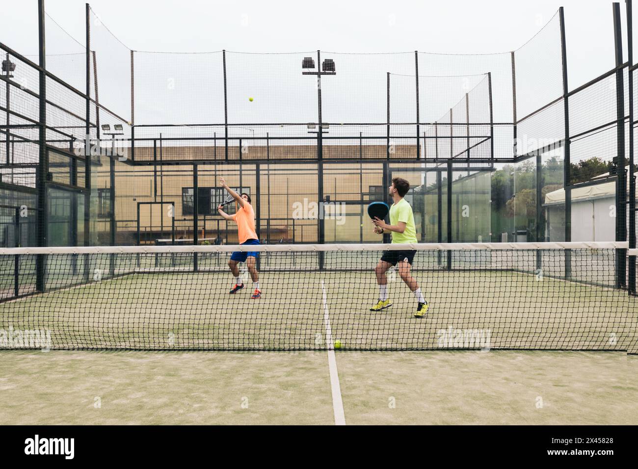 two young man playing paddle tennis Stock Photo