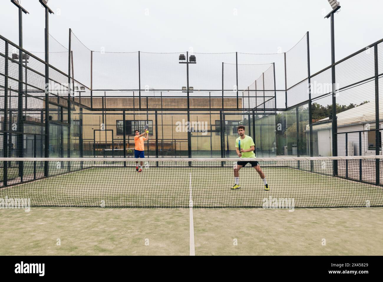 two young man playing paddle tennis Stock Photo