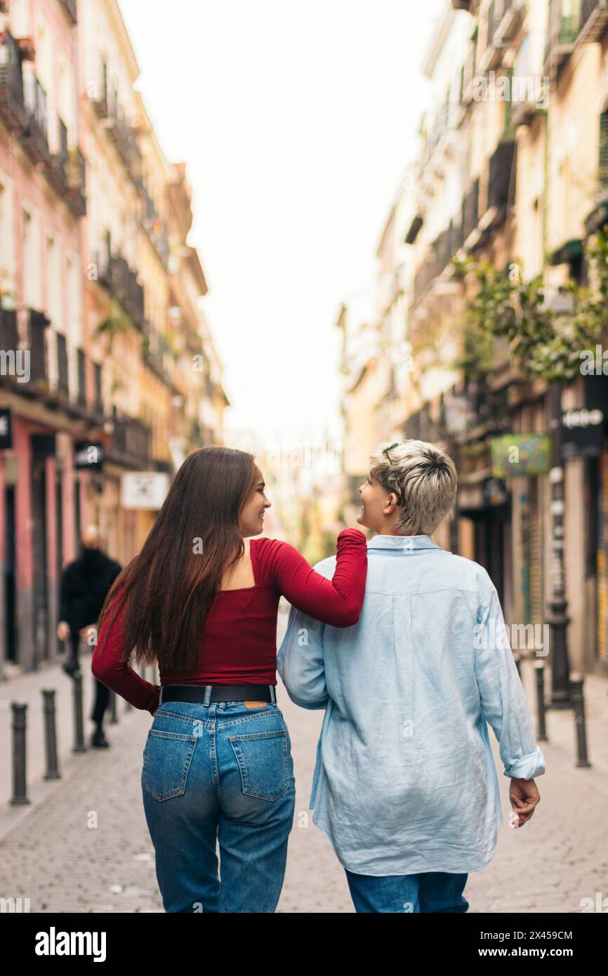 back view of two teenager girls walking on a street Stock Photo - Alamy