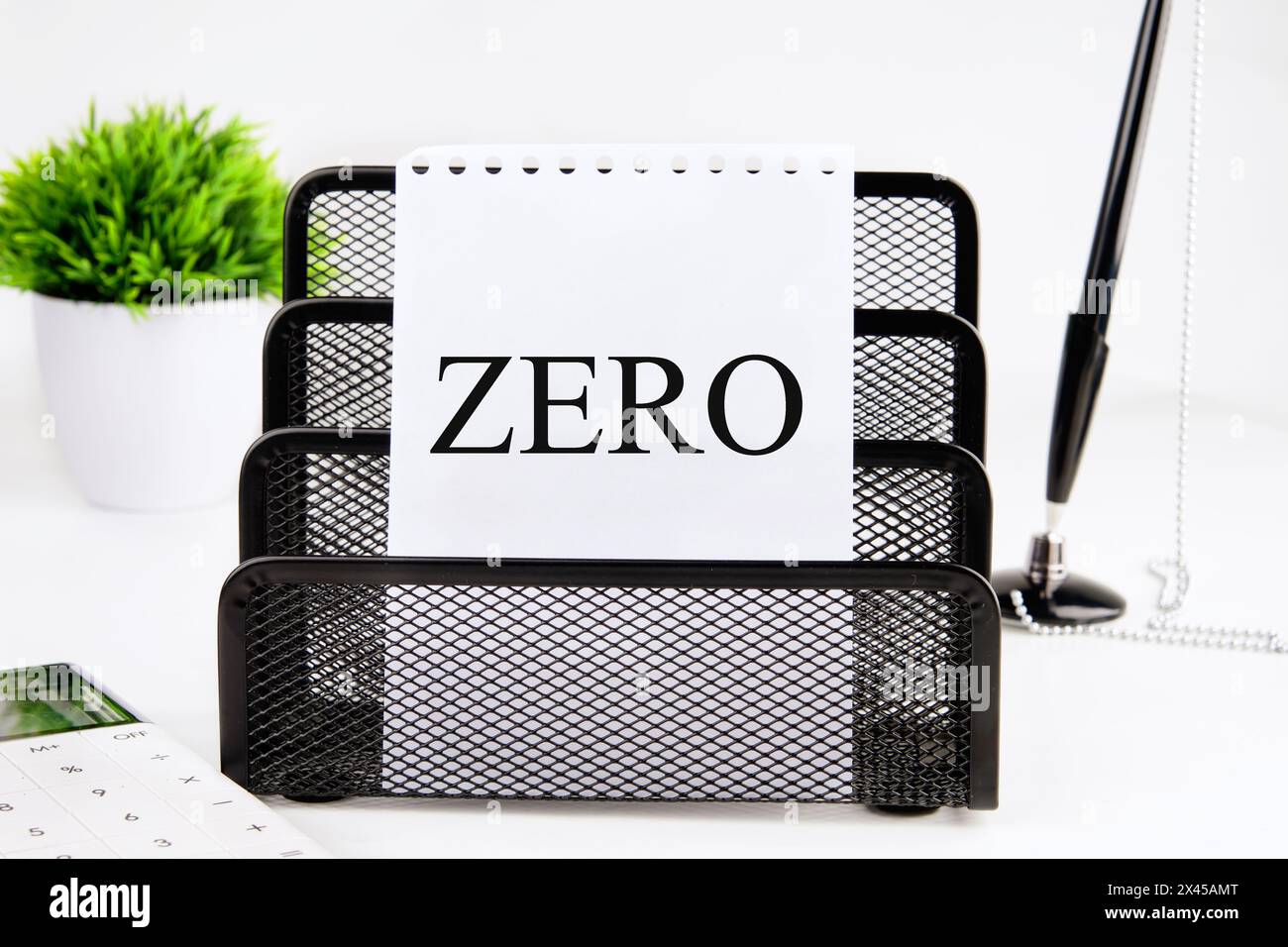 Zero, word written on a blank sheet in a black stand on a white background Stock Photo