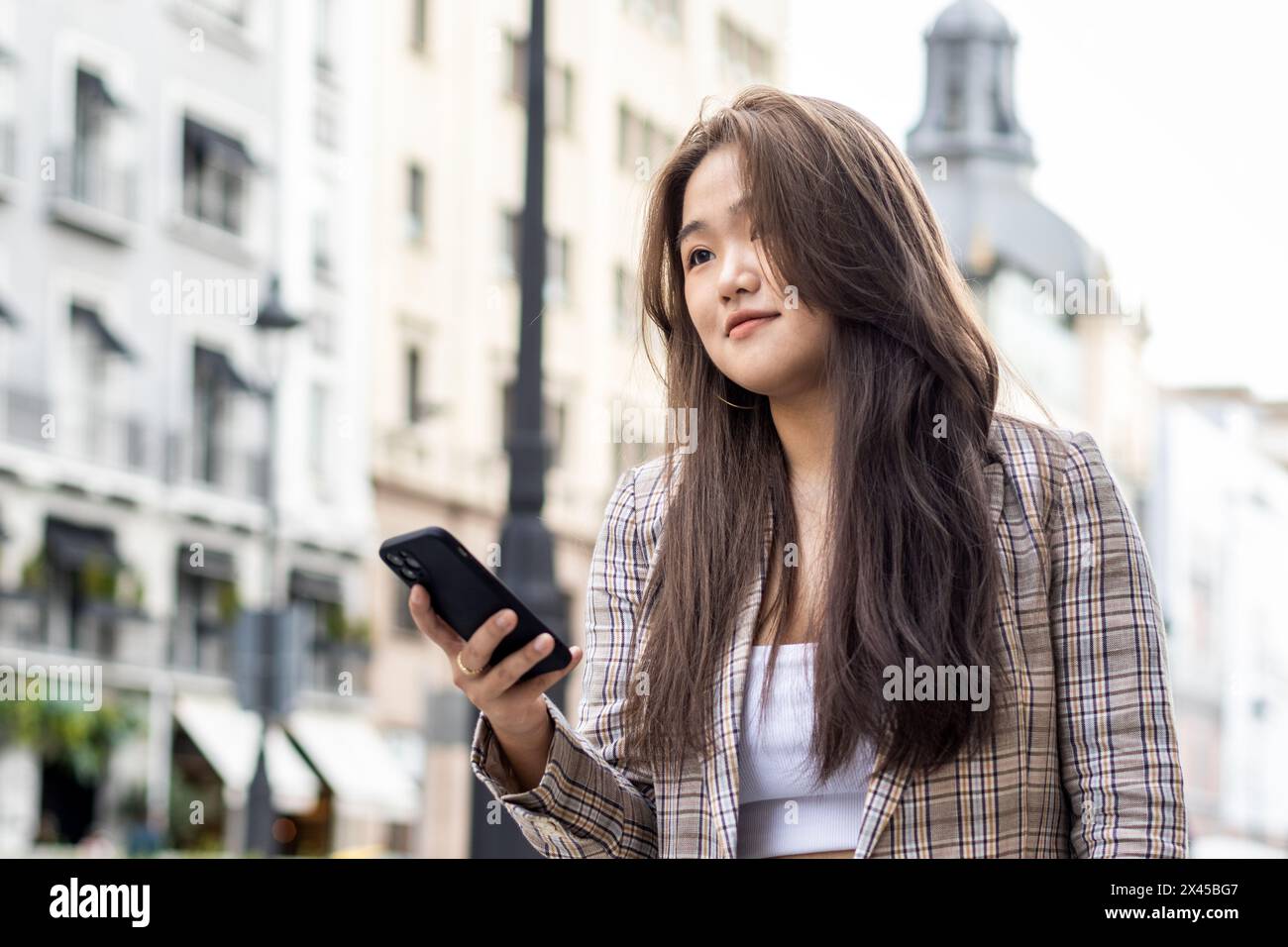 Attractive asian woman walking hi-res stock photography and images - Alamy