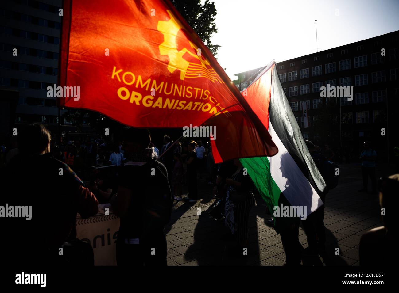 Berlin, Germany. 30th Apr, 2024. The flags of the Palestinian autonomous territories and the communist organization can be seen at a demonstration by left-wing groups under the slogan 'For peace and social justice' in Wedding. Credit: Christoph Soeder/dpa/Alamy Live News Stock Photo