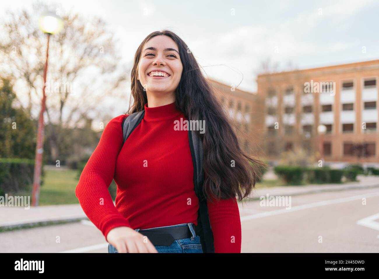 beautiful Student girl portrait leaving class and smiling Stock Photo