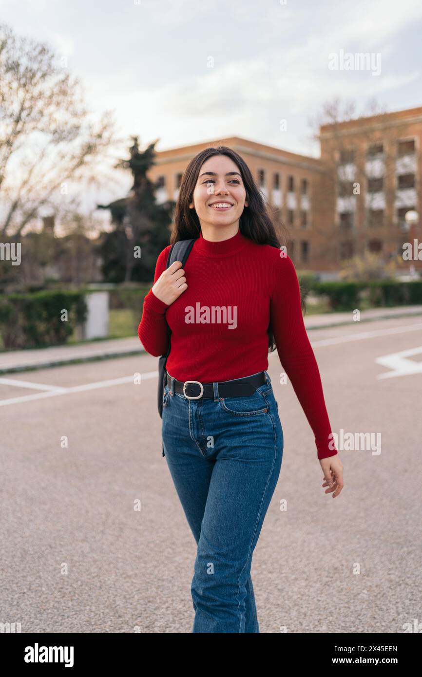 Beautiful Student girl portrait leaving class and smiling. walking Stock Photo