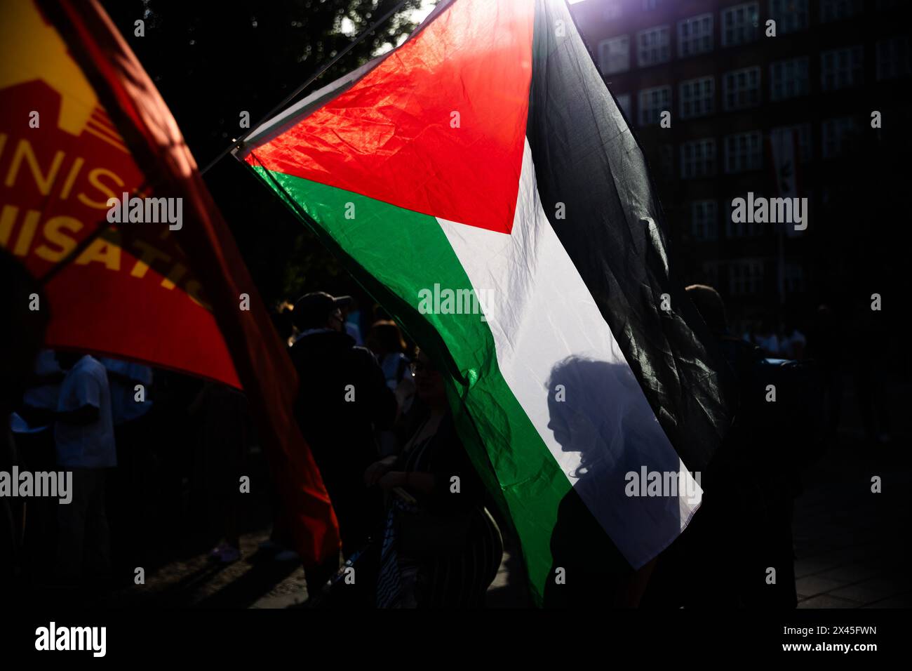 Berlin, Germany. 30th Apr, 2024. The flag of the Palestinian autonomous territories can be seen at a demonstration by left-wing groups under the slogan 'For peace and social justice' in Wedding. Credit: Christoph Soeder/dpa/Alamy Live News Stock Photo