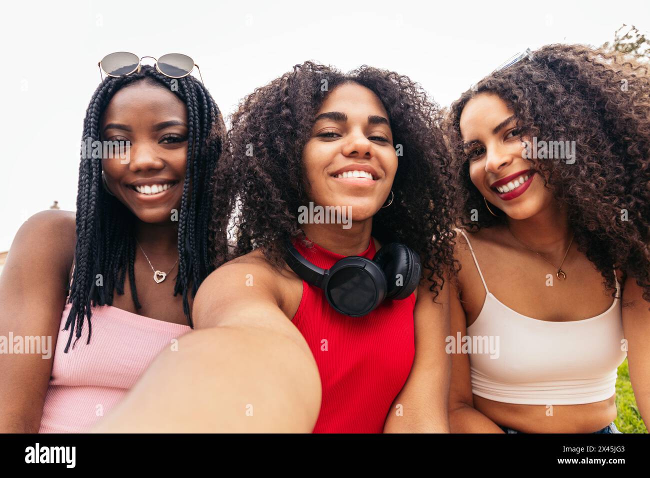 Selfie of three African American girls with afro hair laughing. They ...