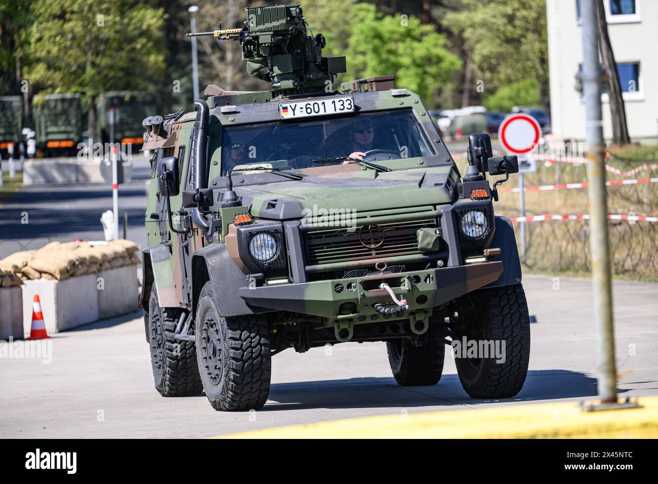 30 April 2024, Saxony, Weißkeißel: Bundeswehr soldiers drive along the ...