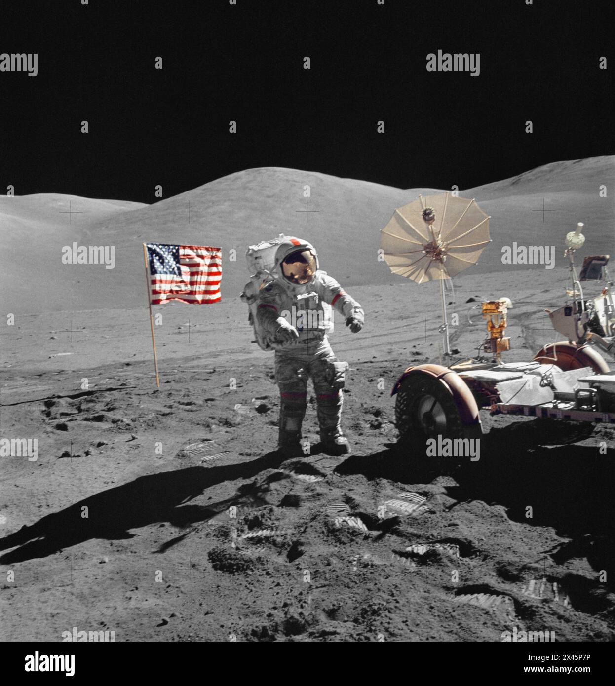 Astronaut Eugene A. Cernanand on the moon with the LRV during an Apollo mission in 1972 Stock Photo