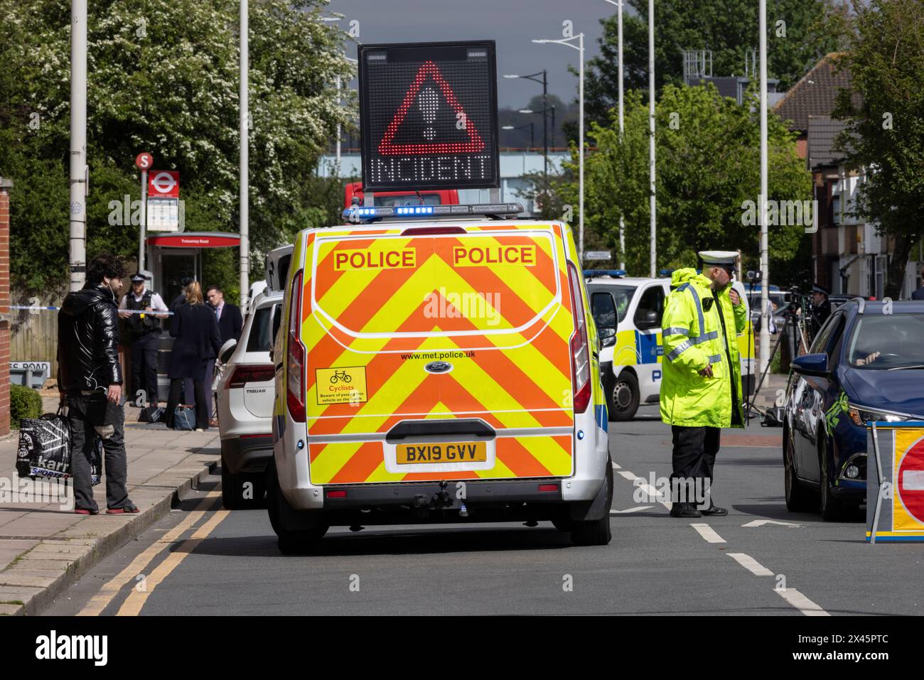 Police and other emergency services in Hainault, east London, at a serious incident in which a man with a sword was arrested after attacking people. Stock Photo