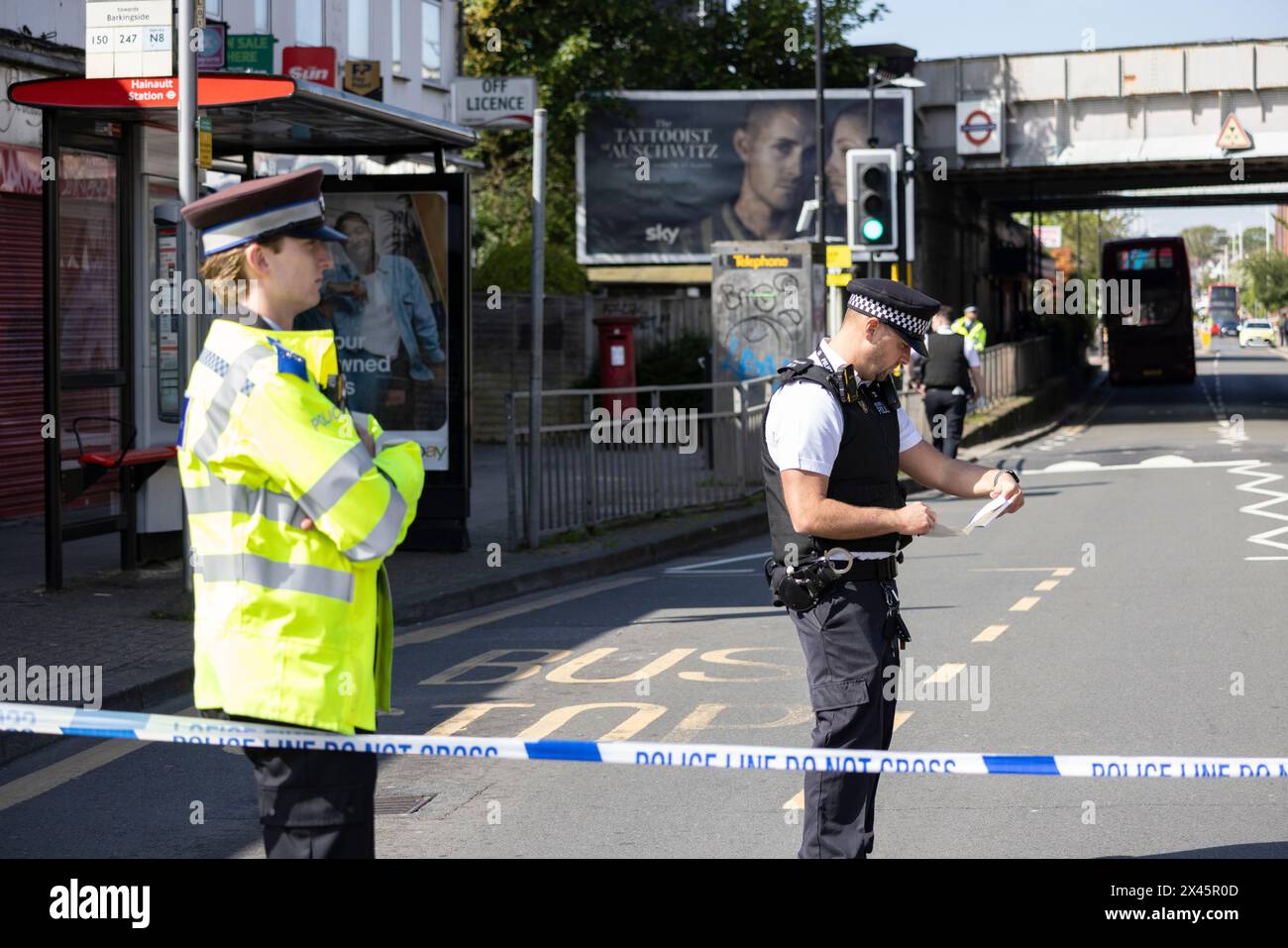 Police and other emergency services in Hainault, east London, at a serious incident in which a man with a sword was arrested after attacking people. Stock Photo