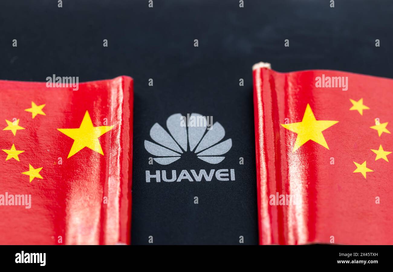 London. UK- 04.26.2024. A China technology concept with the logo of Huawei in the middle of two Chinese national flags. Stock Photo