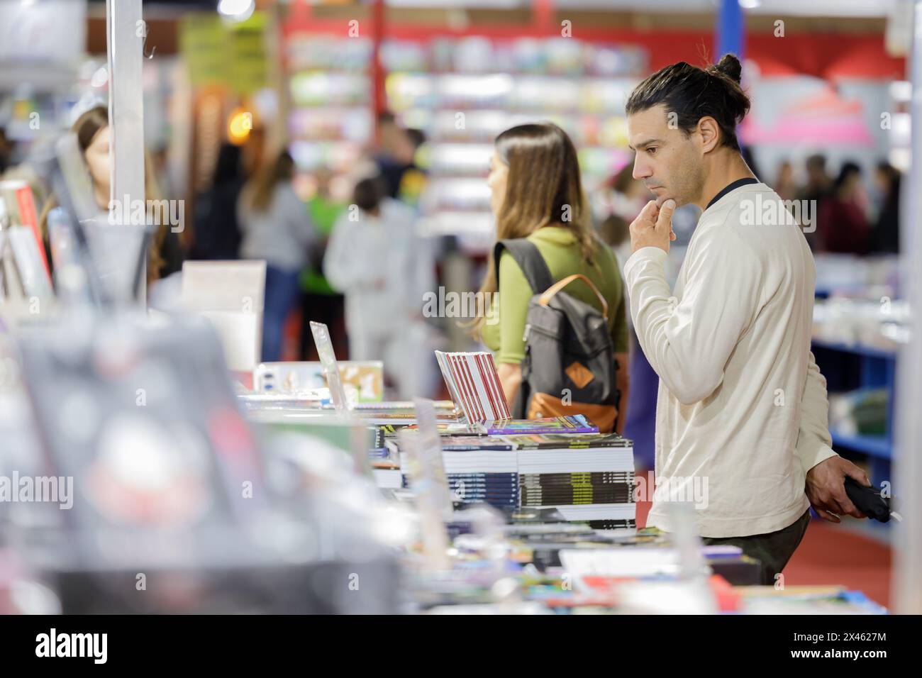 Buenos Aires, Argentina; April 26th 2024: Young man looking at books at ...