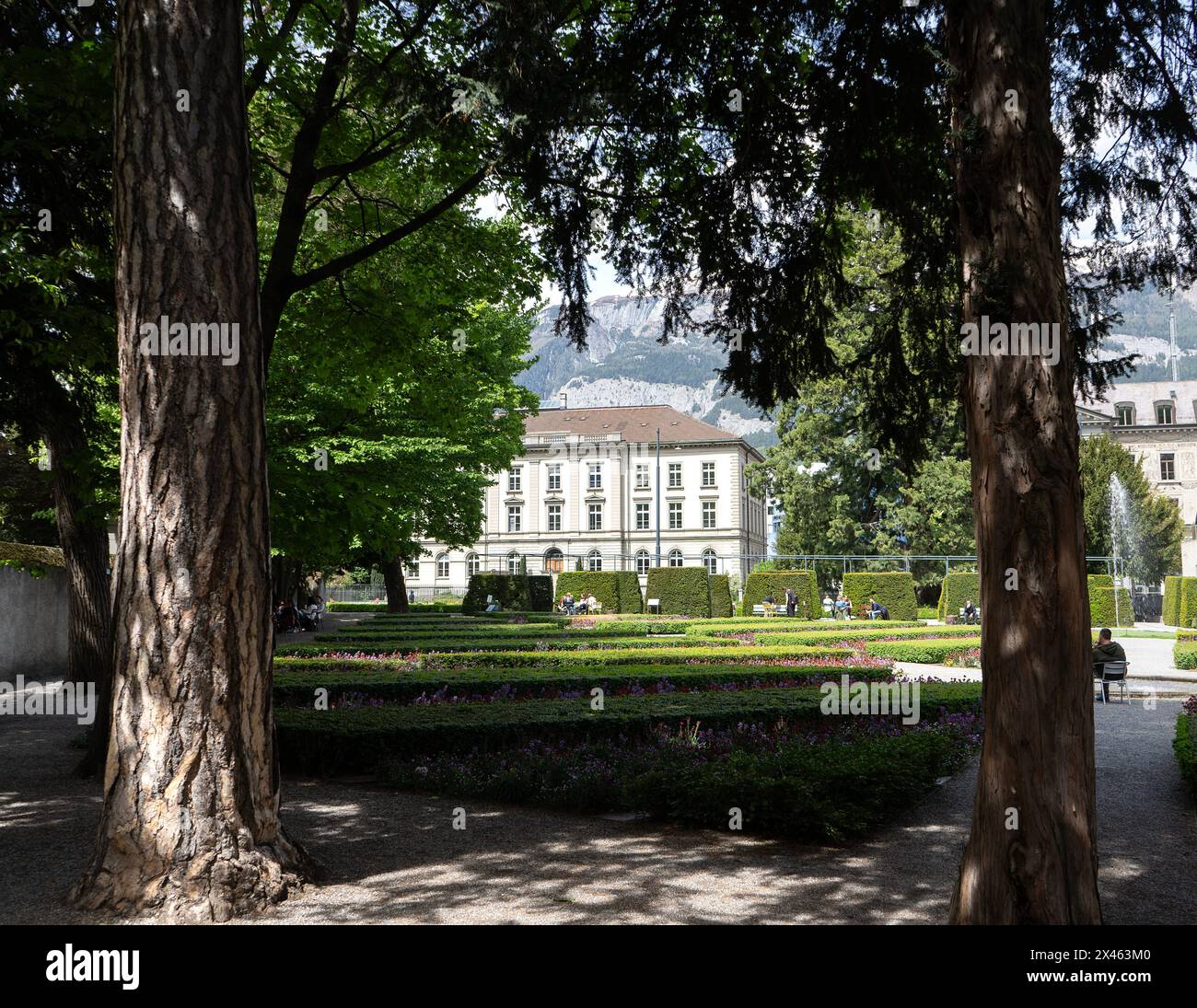 Fontana Park with former State Council Building in the background, Chur, Switzerland Stock Photo