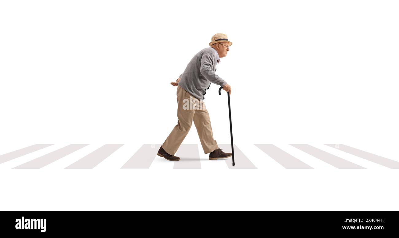 Full length profile shot of a senior man walking with a cane at a