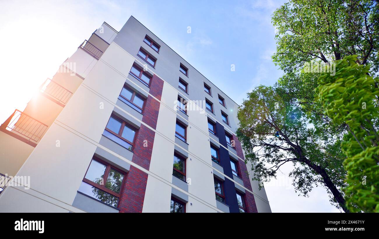Modern residential building with new apartments in a green residential ... - Green Apartment Home Builders